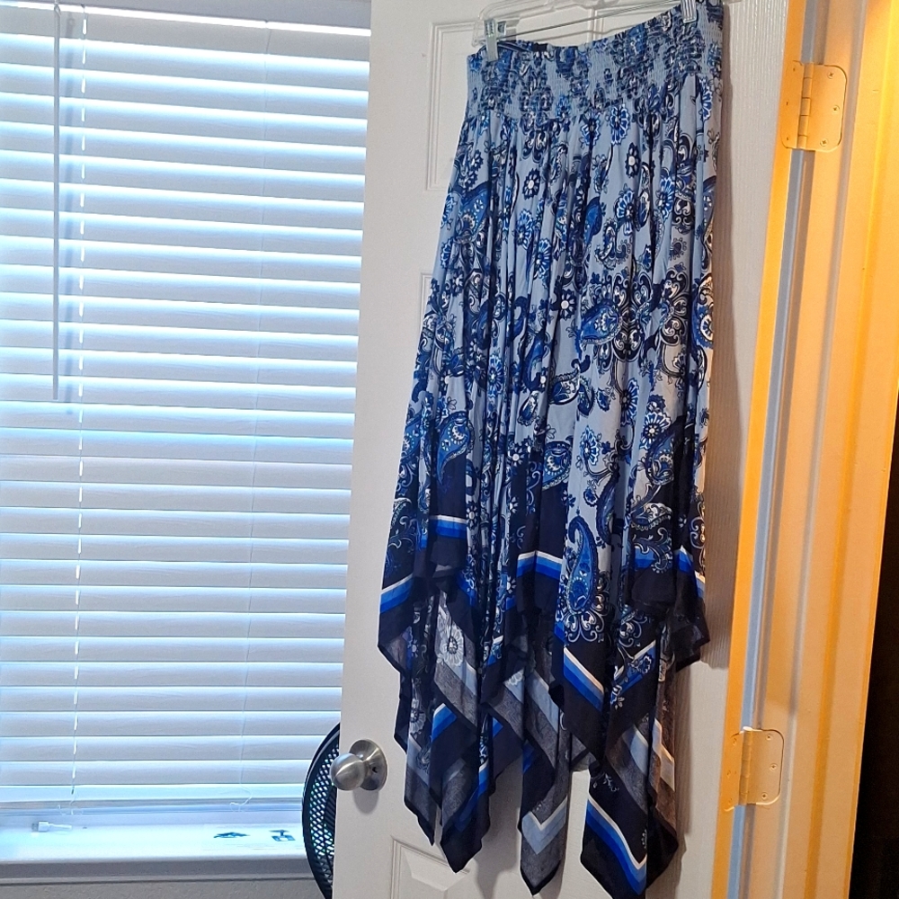 Blue skirt longer in back shorter in front